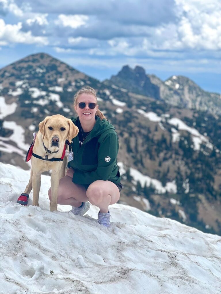Jessie and service dog hiking in the snow
