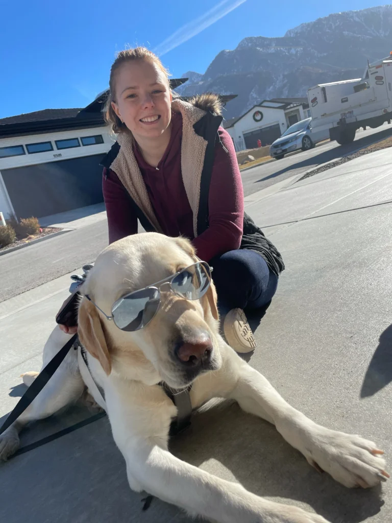 Jessie Rudin with Service Dog in Training Puppy Jake Foundation, Iowa